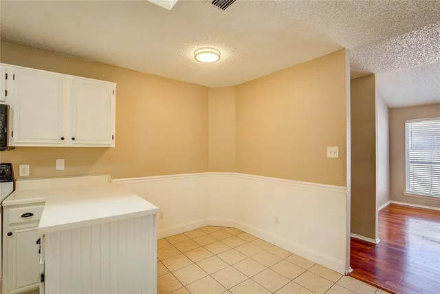 a view of storage and utility room with wooden floor