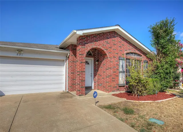a front view of a house with a garage