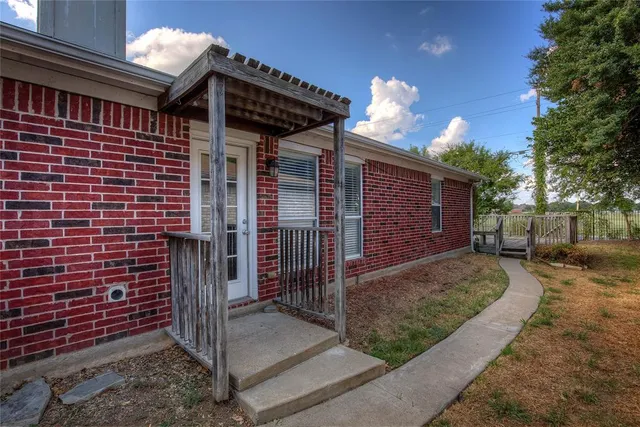 a view of a house with a iron fence