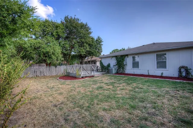 a backyard of a house with lots of green space