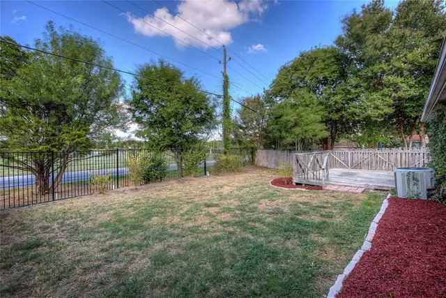 a view of a backyard with swings
