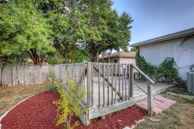 a view of garden with wooden stairs