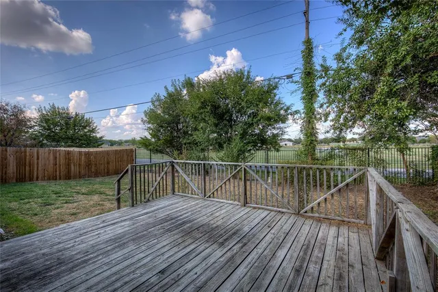 a view of balcony with deck and wooden floor