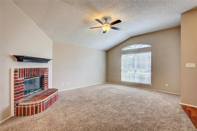 a view of an empty room with windows
