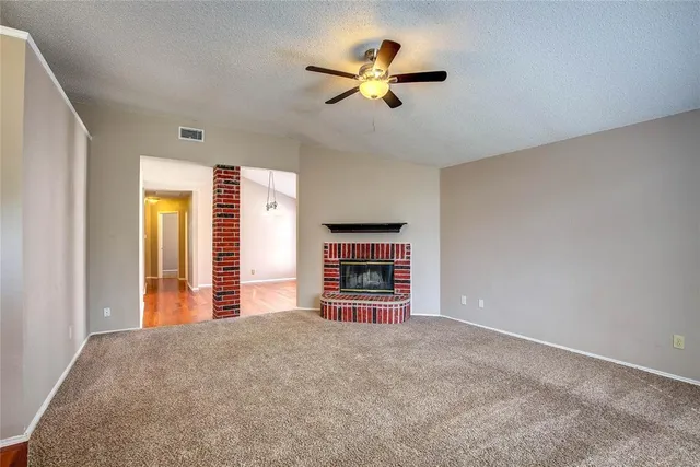 a view of a livingroom with a ceiling fan