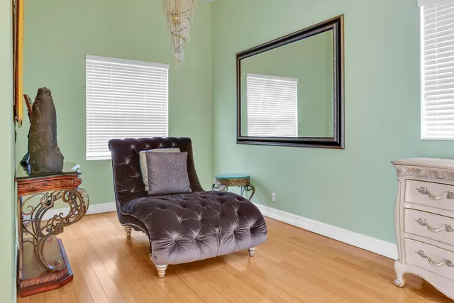 a bedroom with a bed and a couch