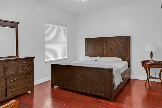 a view of a room with wooden floor