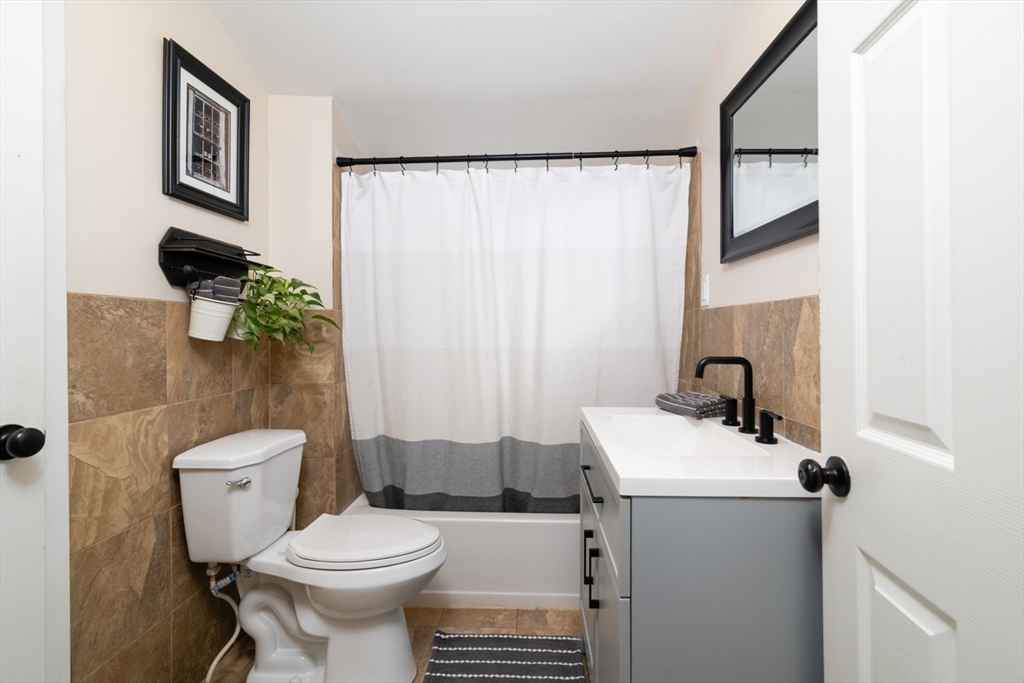 501 Spring Street Hanson, MA 02341 - Photo 16 of 32 a bathroom with a sink toilet and shower