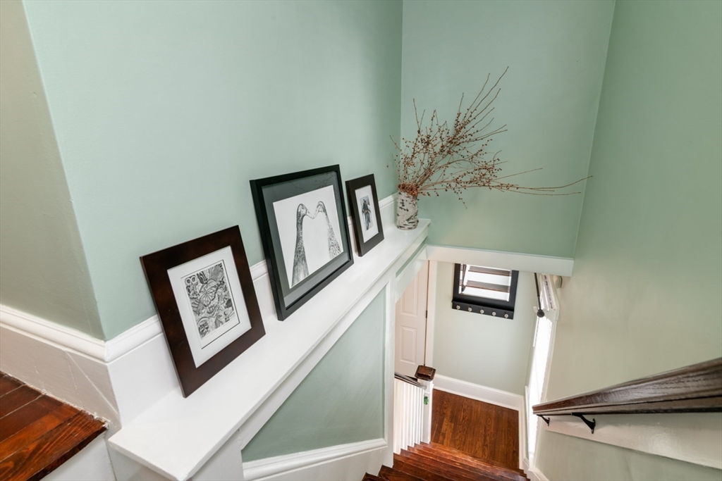 501 Spring Street Hanson, MA 02341 - Photo 17 of 32 a view of a hallway with paintings on the wall
