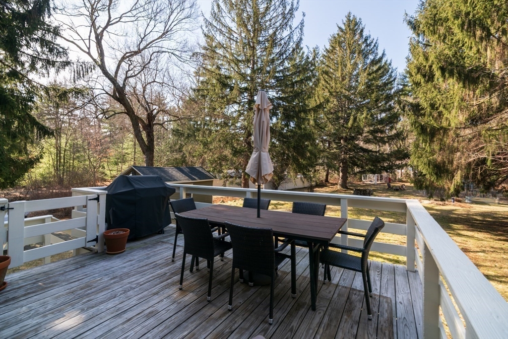 501 Spring Street Hanson, MA 02341 - Photo 18 of 32 a view of backyard with seating space and trees