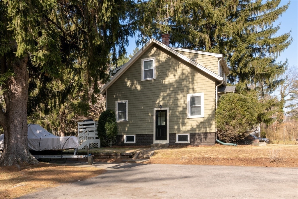 501 Spring Street Hanson, MA 02341 - Photo 20 of 32 a view of a house with a yard and tree s