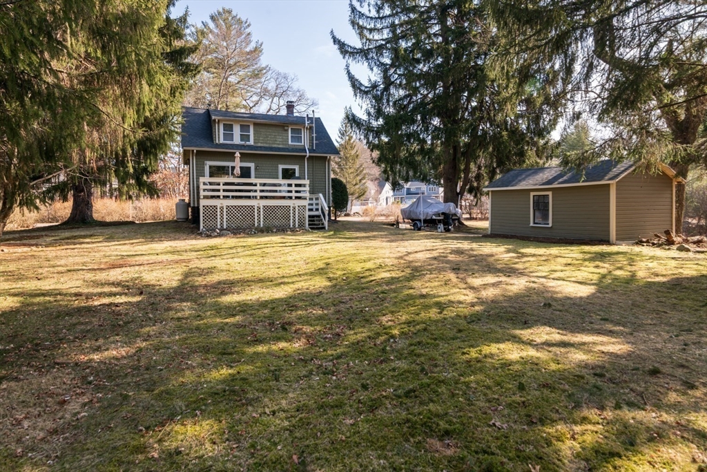 501 Spring Street Hanson, MA 02341 - Photo 21 of 32 a view of a house with a yard