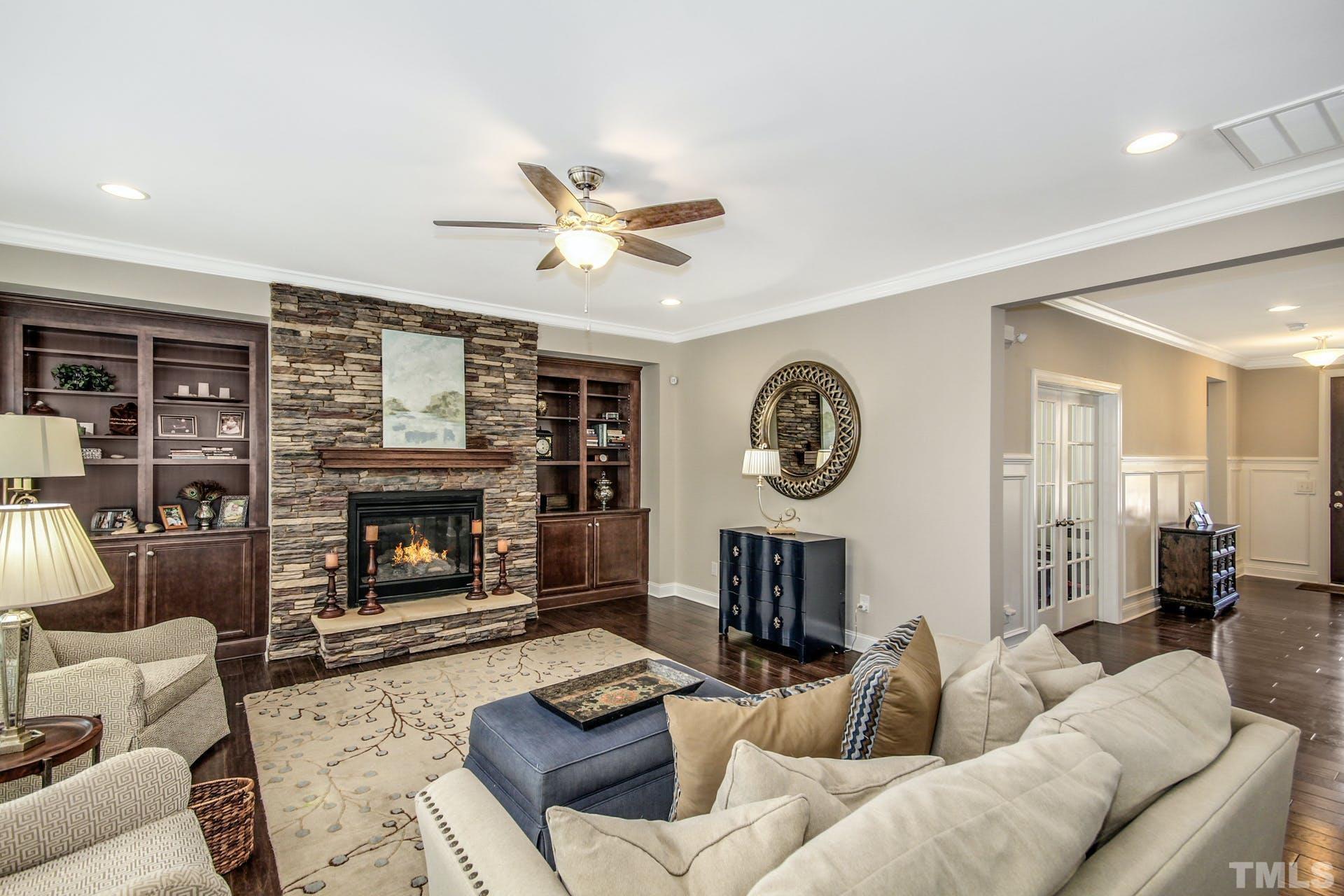 2013 White Rocks Road Wake Forest, NC 27587 - Photo 12 of 36 a living room with furniture a fireplace and a large window