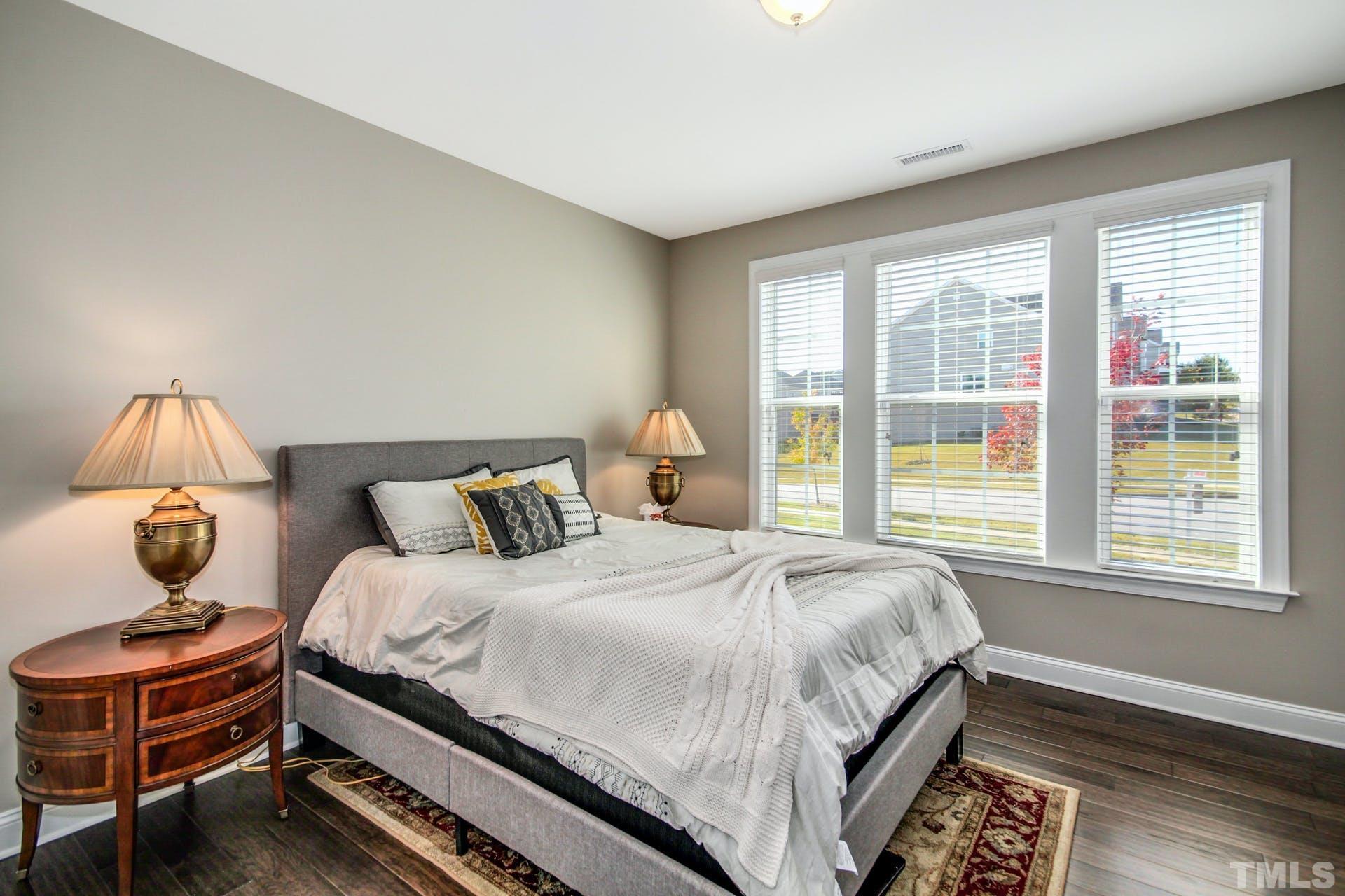 2013 White Rocks Road Wake Forest, NC 27587 - Photo 14 of 36 a bedroom with a bed and window