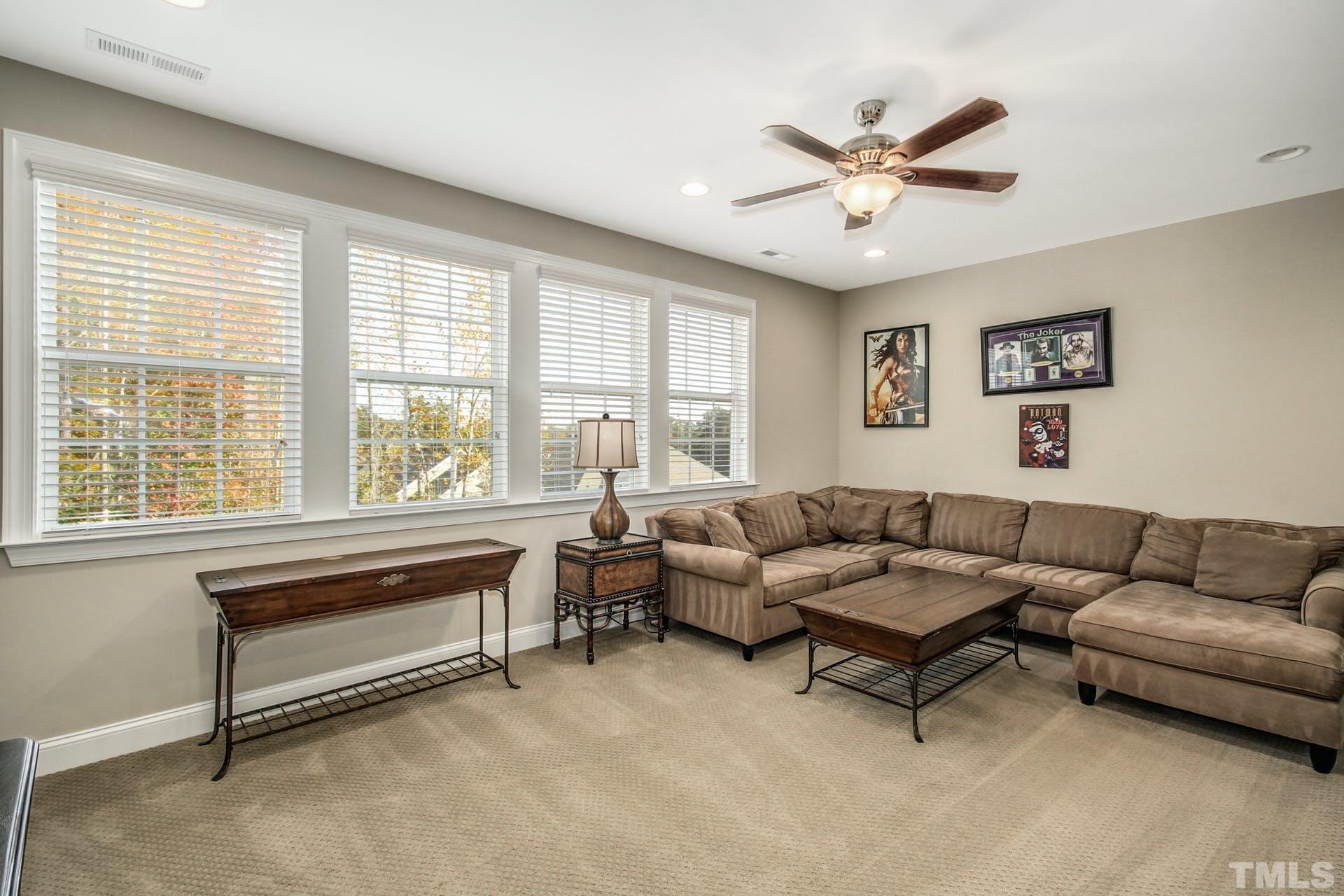 2013 White Rocks Road Wake Forest, NC 27587 - Photo 22 of 36 a living room with furniture and a large window
