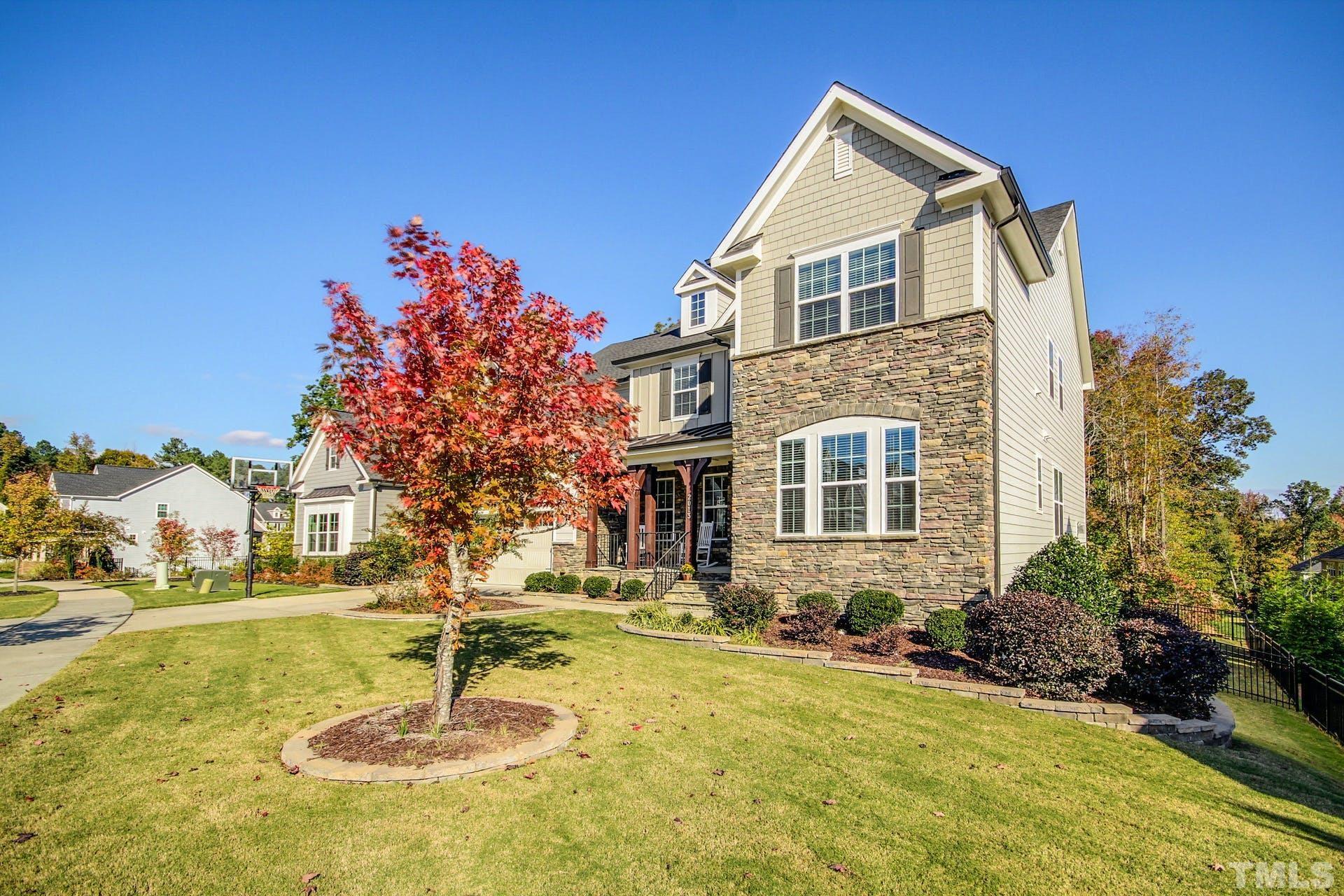2013 White Rocks Road Wake Forest, NC 27587 - Photo 3 of 36 a front view of a house with a yard