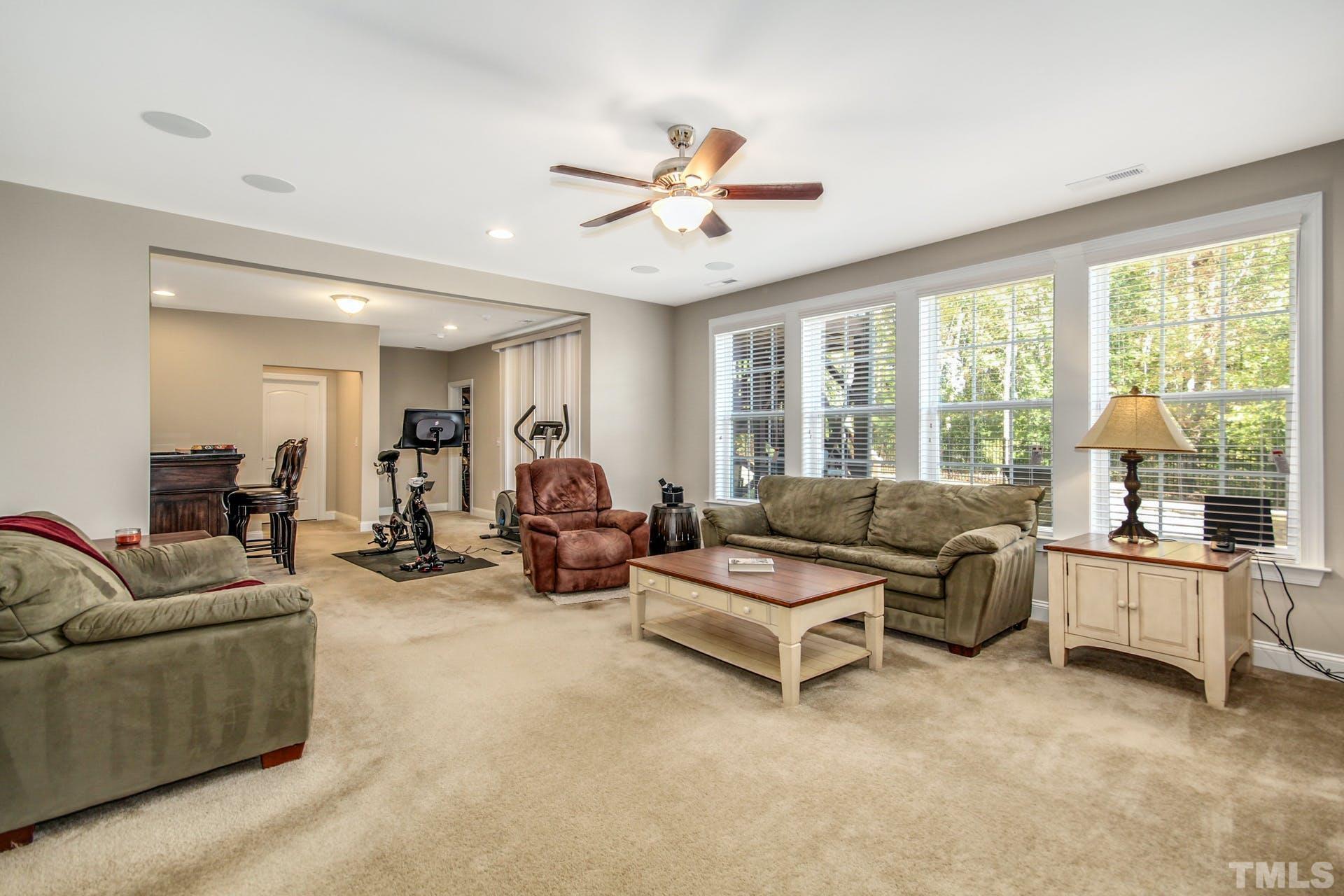 2013 White Rocks Road Wake Forest, NC 27587 - Photo 31 of 36 a living room with furniture and a large window