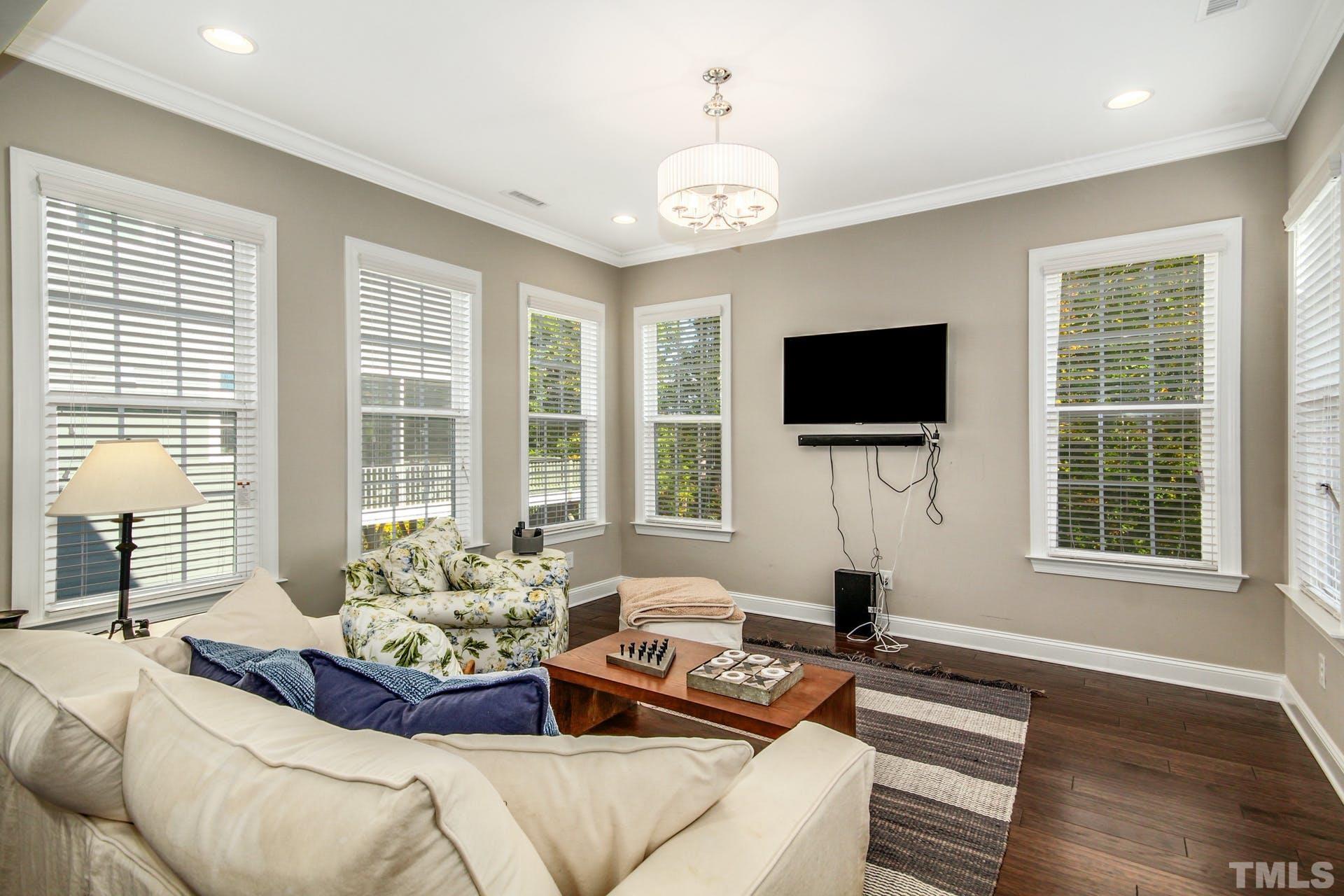 2013 White Rocks Road Wake Forest, NC 27587 - Photo 10 of 36 a living room with fireplace furniture and a flat screen tv