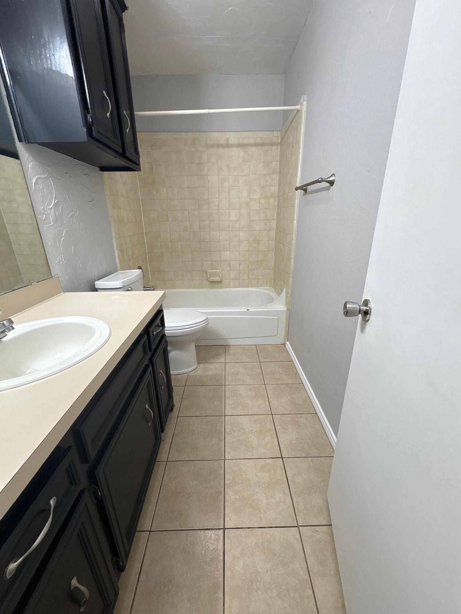 3421 Hyden Avenue Lubbock, TX 79407 - Photo 10 of 18 a bathroom with a sink a toilet and bathtub