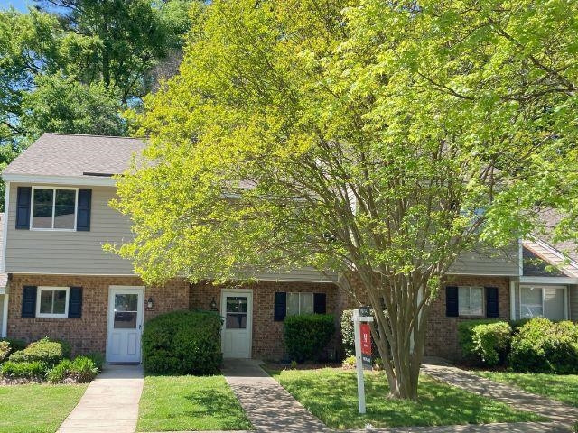 2104 Spring Forest Road, Unit 2104 Raleigh, NC 27615 - Photo 2 of 9 a front view of a house with a yard