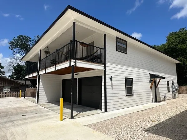 a front view of a house with a garage