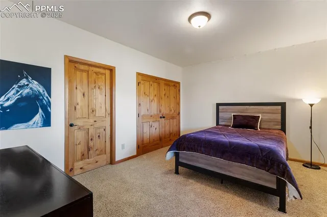 a bedroom with a bed and a couch