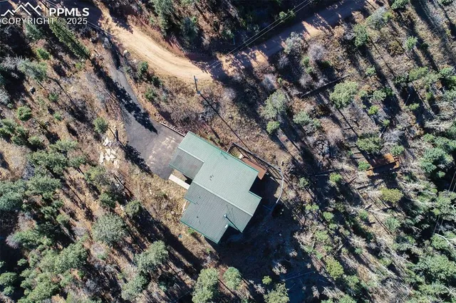 a view of a house with a tree