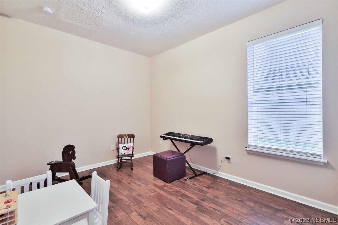 1922 Cove Point Road Port Orange, FL 32128 - Photo 17 of 54 a living room with furniture and a window