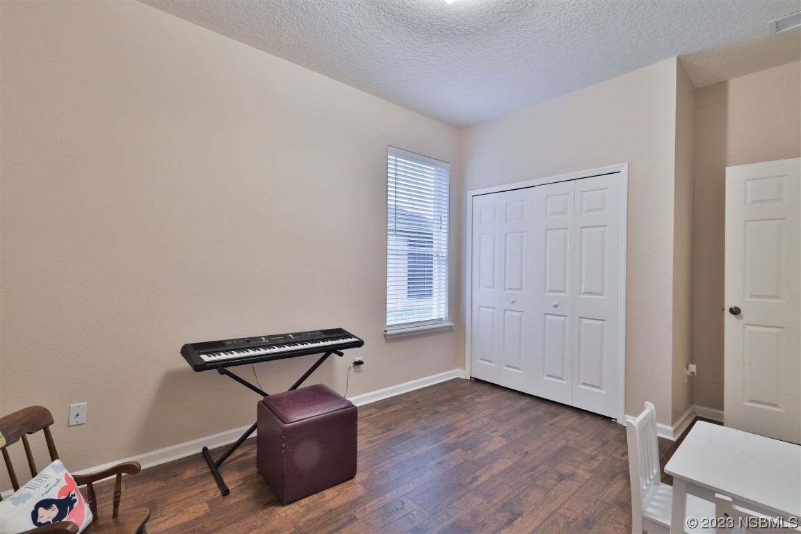 1922 Cove Point Road Port Orange, FL 32128 - Photo 18 of 54 a view of a room with gym equipment