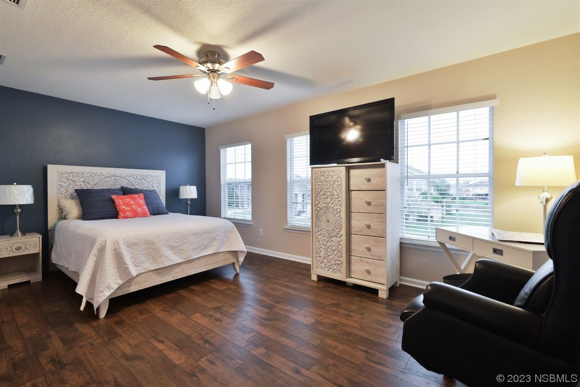 1922 Cove Point Road Port Orange, FL 32128 - Photo 25 of 54 a bedroom with a bed and a flat screen tv