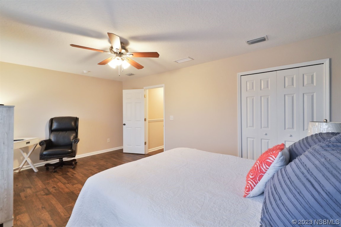 1922 Cove Point Road Port Orange, FL 32128 - Photo 26 of 54 a bedroom with a bed and furniture