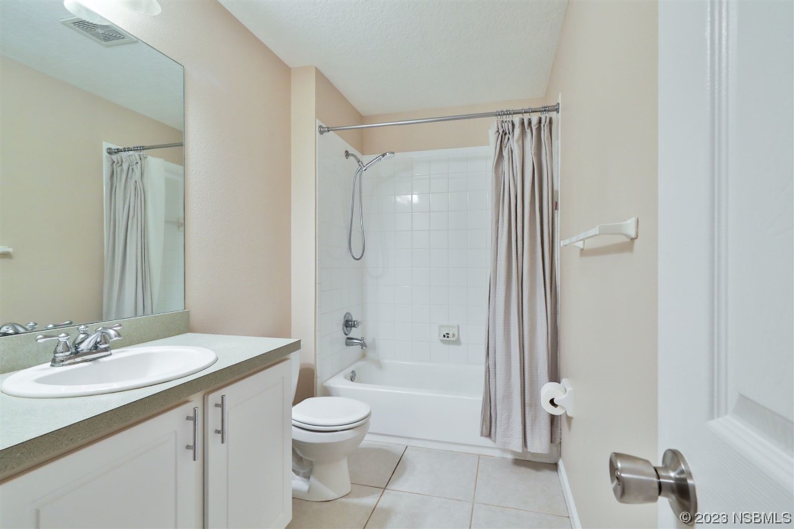 1922 Cove Point Road Port Orange, FL 32128 - Photo 27 of 54 a bathroom with a granite countertop sink toilet and shower