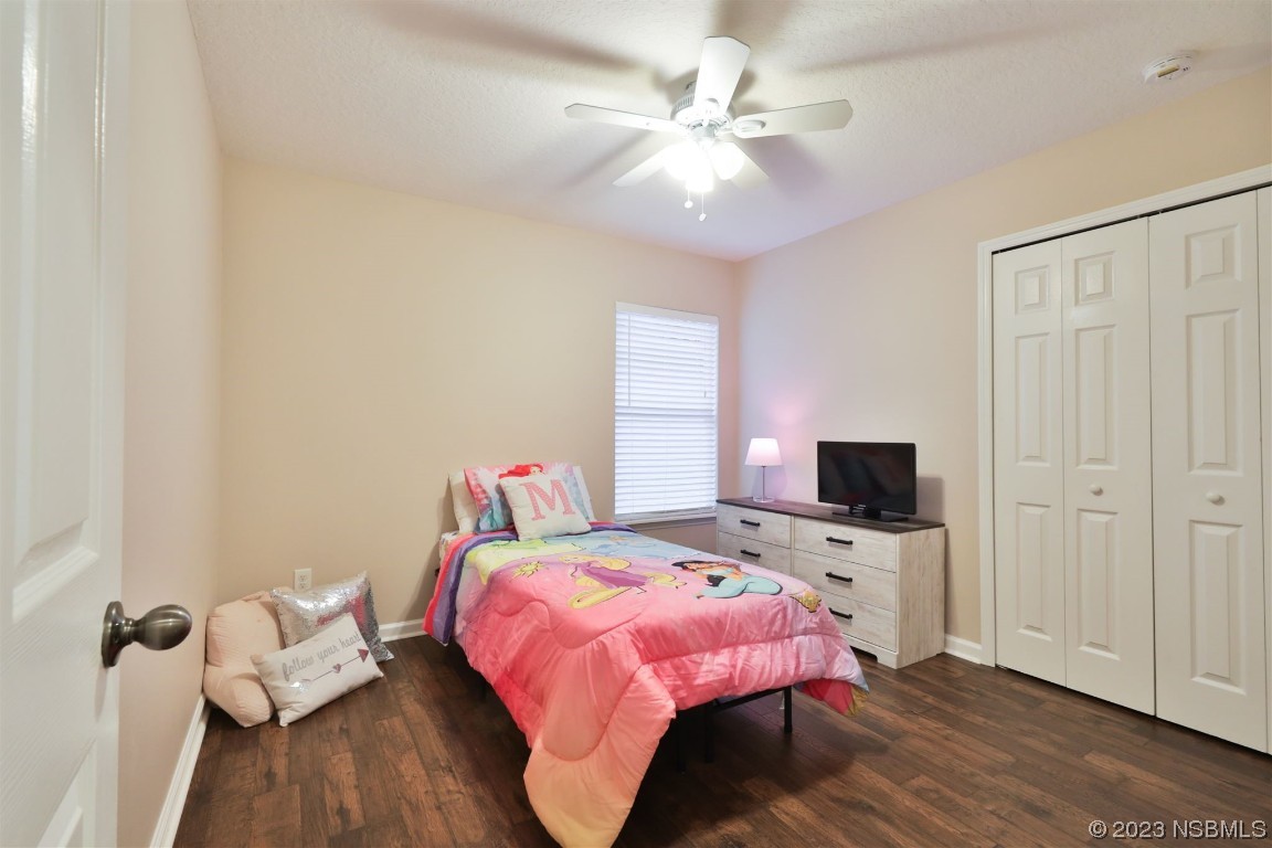 1922 Cove Point Road Port Orange, FL 32128 - Photo 28 of 54 a bedroom with a bed and wooden floor