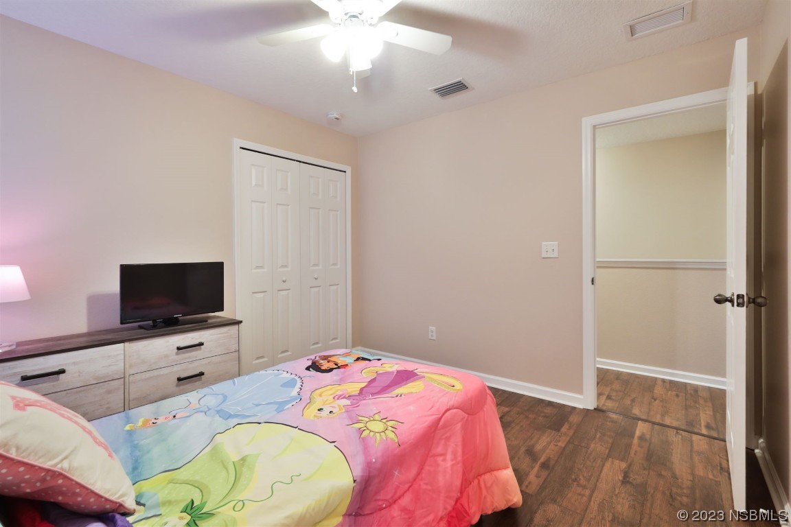 1922 Cove Point Road Port Orange, FL 32128 - Photo 29 of 54 a bedroom with a bed and a flat screen tv