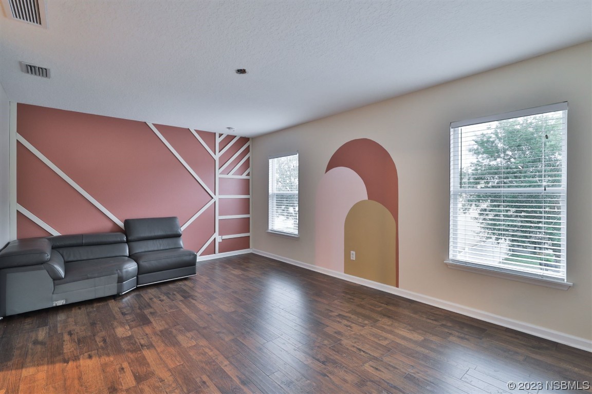 1922 Cove Point Road Port Orange, FL 32128 - Photo 30 of 54 a view of a livingroom with furniture and wooden floor