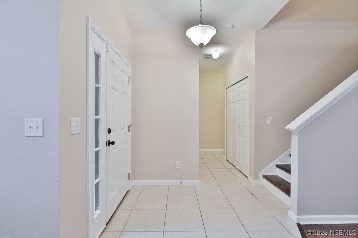 1922 Cove Point Road Port Orange, FL 32128 - Photo 3 of 54 a view of an empty room with wooden floor and a window