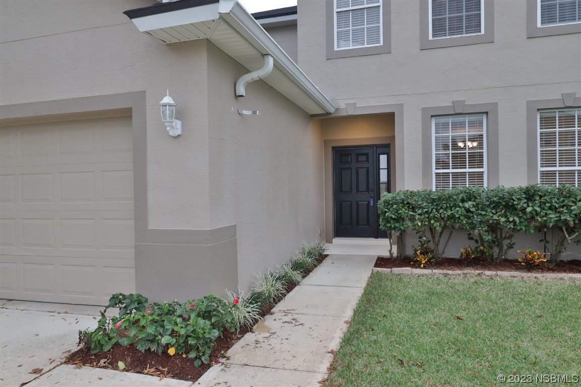 1922 Cove Point Road Port Orange, FL 32128 - Photo 39 of 54 a front view of a house with a yard