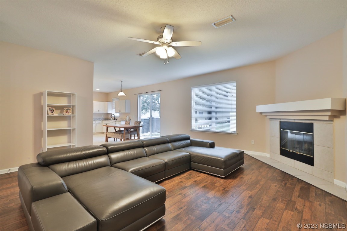 1922 Cove Point Road Port Orange, FL 32128 - Photo 9 of 54 a living room with furniture fireplace and a large window