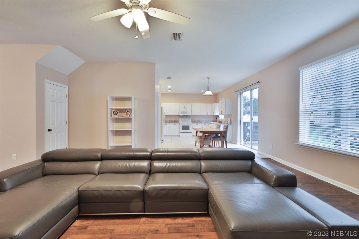 1922 Cove Point Road Port Orange, FL 32128 - Photo 10 of 54 a living room with furniture and a large window