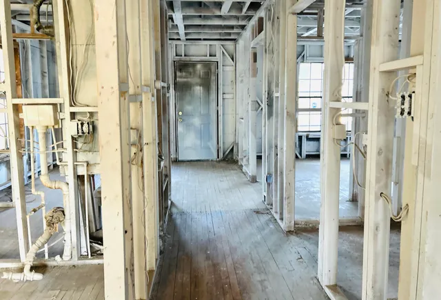 a view of a bathroom with a shower and a door