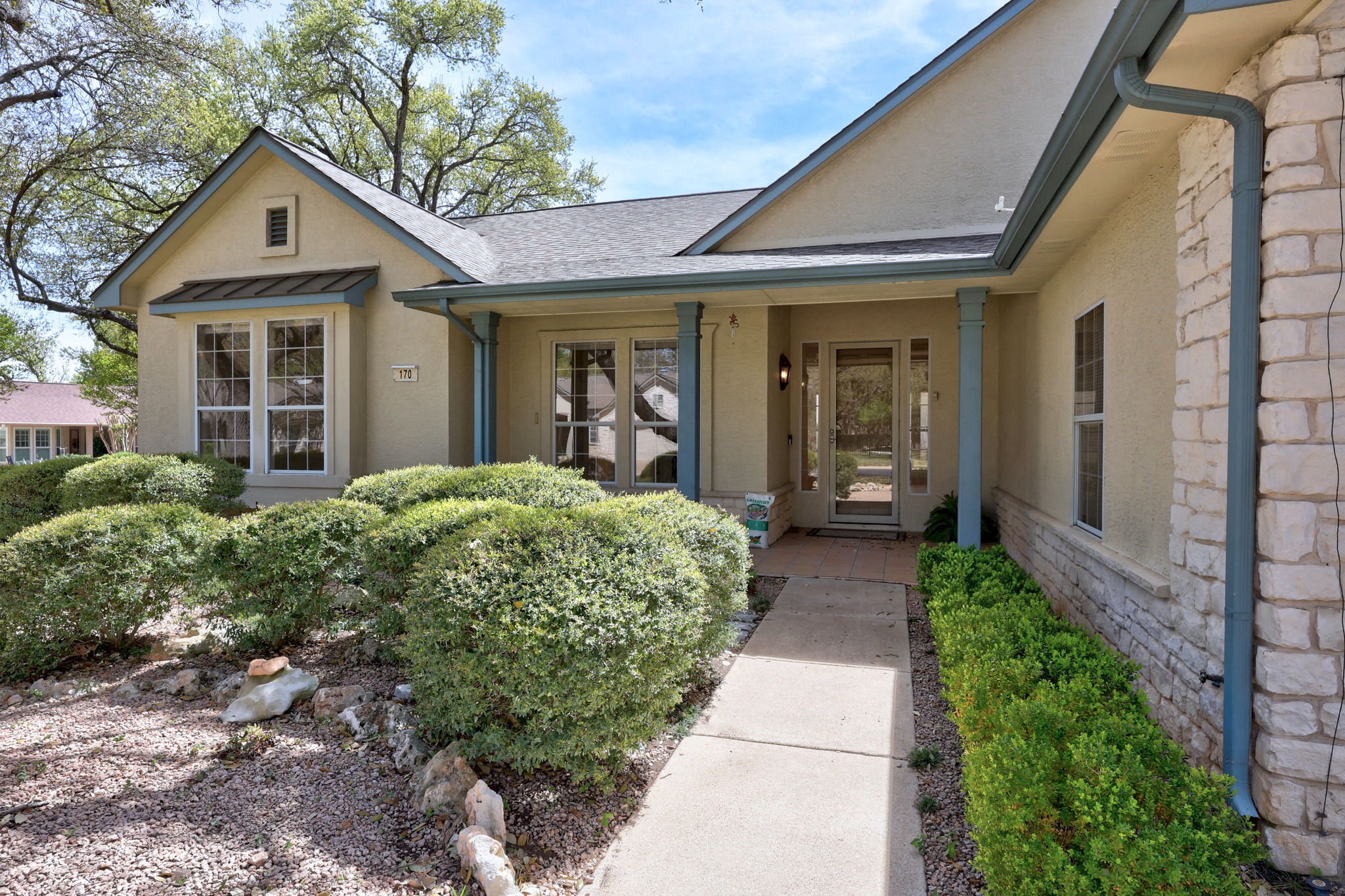 170 Dan Moody Trail Georgetown, TX 78633 - Photo 5 of 30 a view of a brick house with large windows