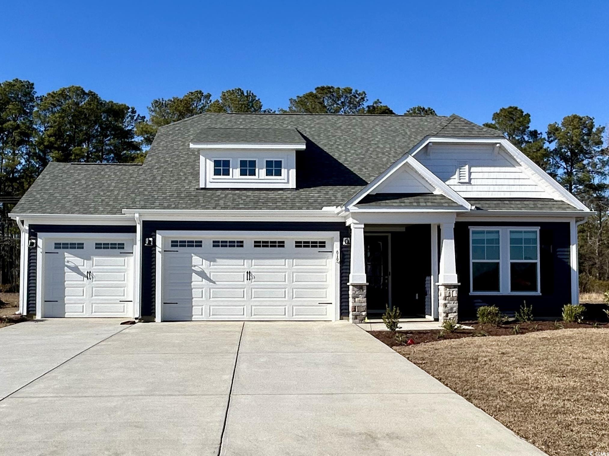 619 Millbrook Way Loris, SC 29569 - Photo 1 of 3 Craftsman-style home with driveway, roof with shingles, and a garage