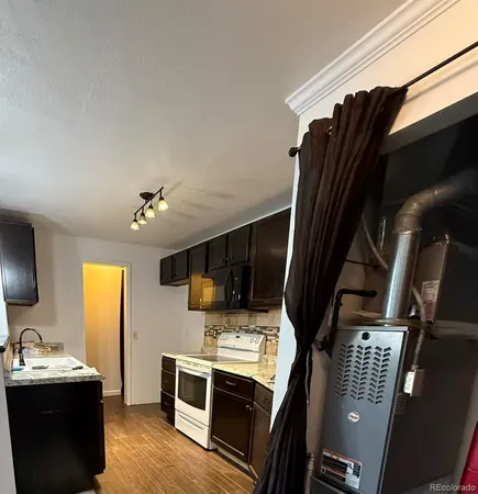 a view of kitchen living room with furniture and flat screen tv