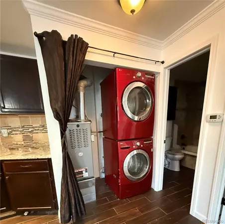a view of a storage and utility room with washer and dryer