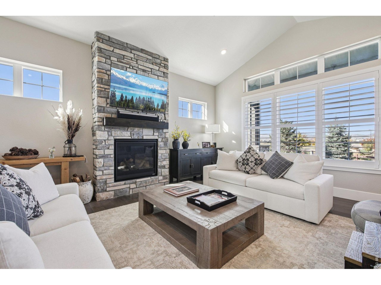 6278 Foundry Court Timnath, CO 80547 - Photo 6 of 40 Living room with stone fireplace