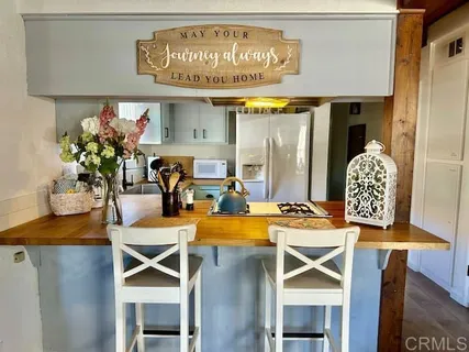 a dining room with furniture and chandelier