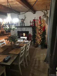 a dining room with furniture and a fireplace