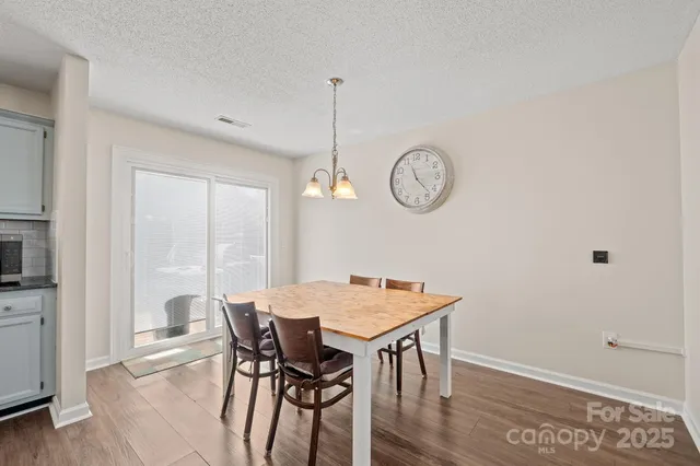 a view of a dining room and a kitchen counter top space