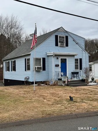 a front view of a house with yard