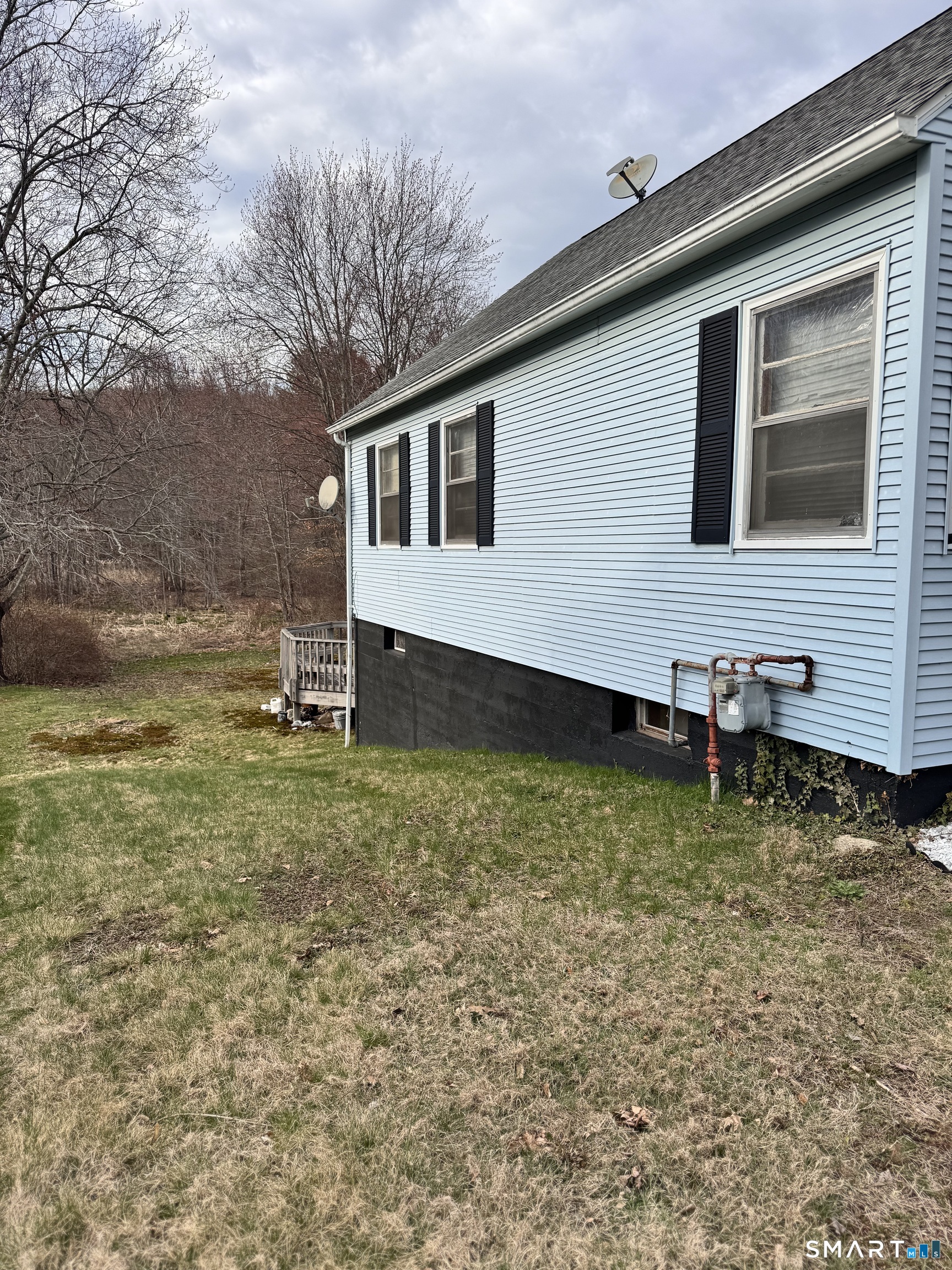 45 Lawrence Street Vernon, CT 06066 - Photo 16 of 17 a backyard of a house with lots of green space